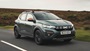 Green Dacia Sandero Stepway Driving