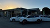 Outside of an Evans Halshaw dealership with white cars parked outside
