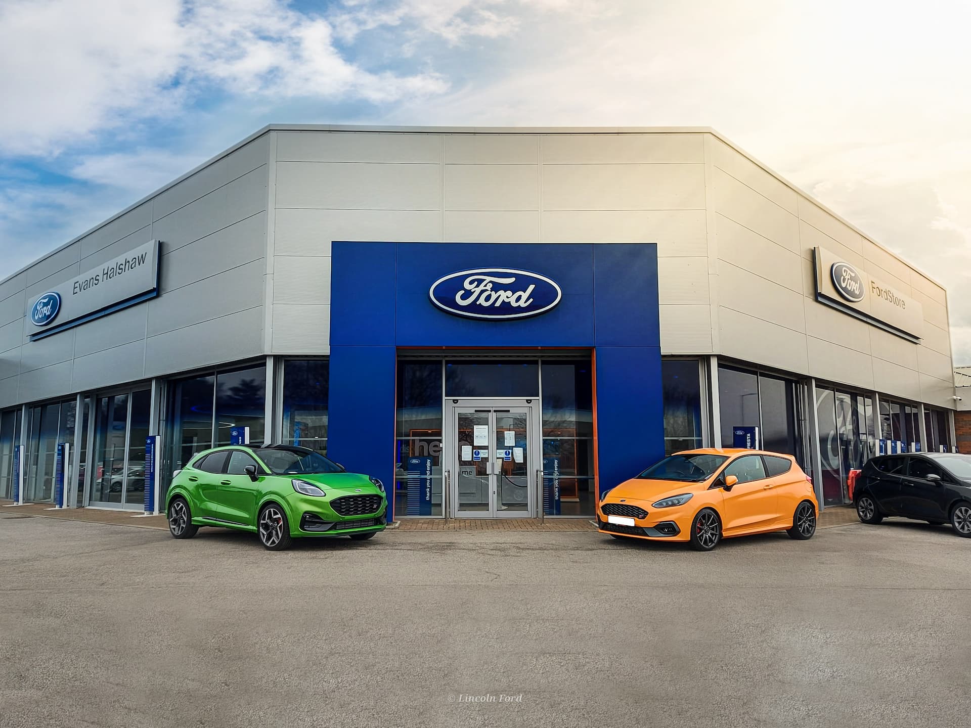 Cars outside the front of Ford Lincoln