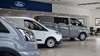 Three vans lined up inside Evans Halshaw Ford Lincoln dealership