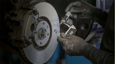 brake disc thickness being measured