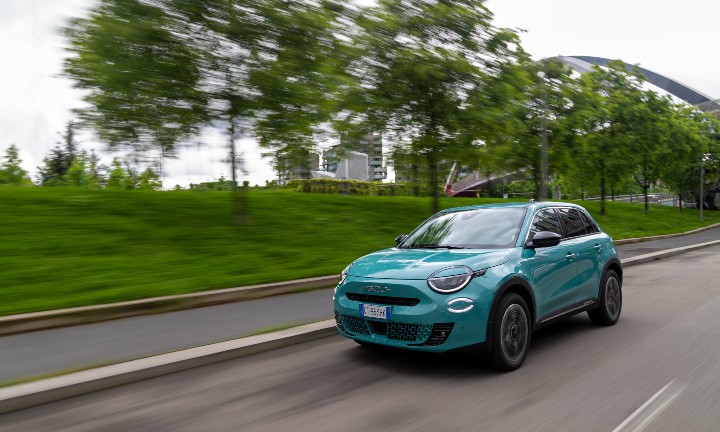 Exterior Front of Blue Fiat 600 Driving in Countryside