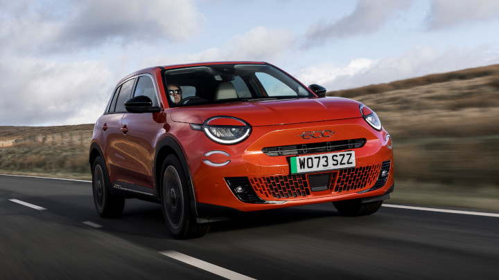 Red Fiat 600 Driving on Road