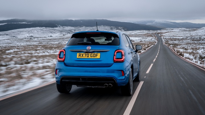 Blue Fiat 500X Sport Exterior Rear Driving in Snowy Countryside