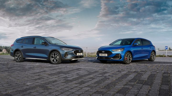 A couple of Ford vehicles parked facing one another