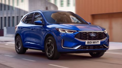 Blue Ford Kuga driving on the road