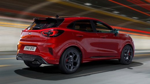 Rear Shot of a Red Ford Puma ST Driving On Road
