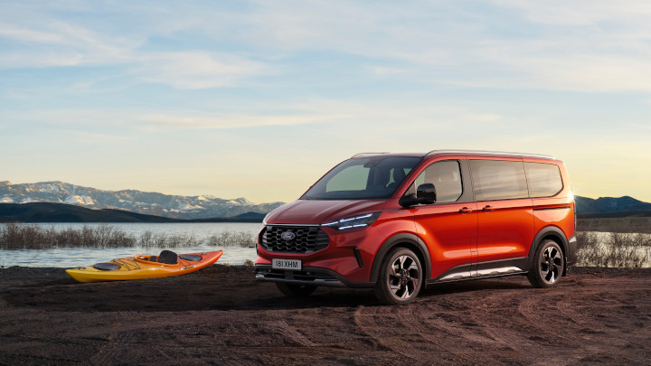 Orange Ford Tourneo Custom Exterior Front on the Lakeside with Canoe