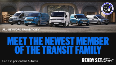 Five Ford Transit Vans Parked On Concrete
