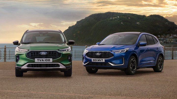 Blue PHEV Ford Kuga in a city. Win a Ford Kuga Plug-In Hybrid promotion