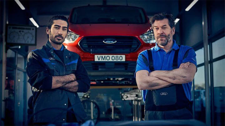 ford technicians standing in front of van