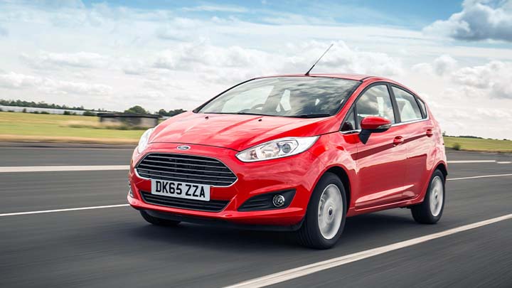 red ford fiesta driving