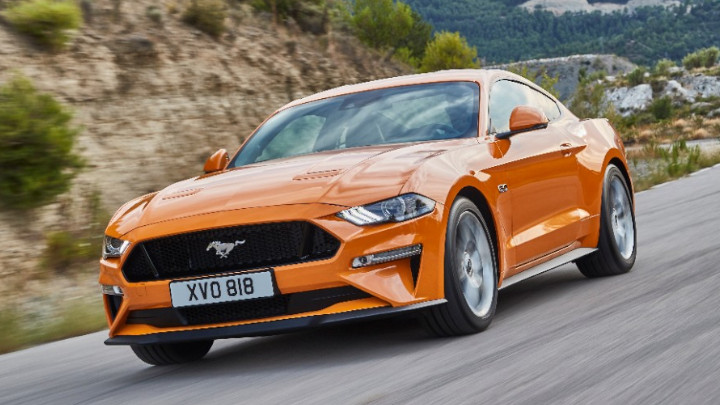 orange ford mustang, driving