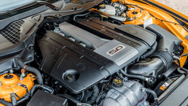 orange ford mustang. coyote v8 engine bay