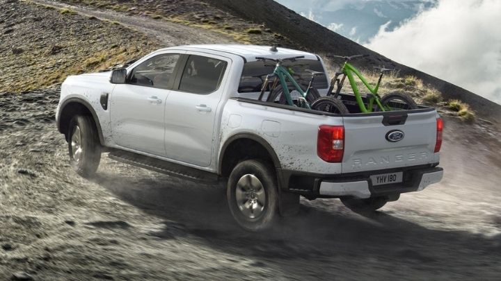 White Ford Ranger Plug-in Hybrid driving up hill