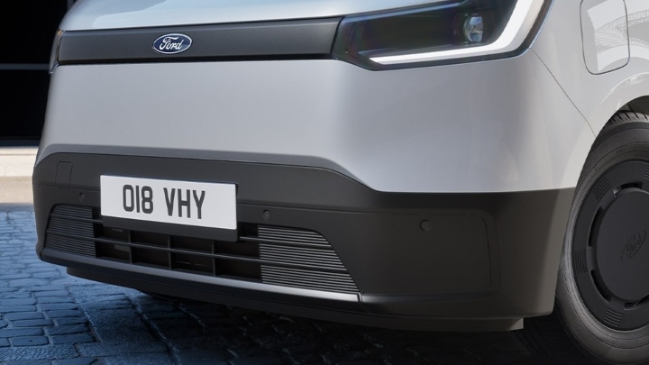 Close‑up view of the Ford Transit City front grille and headlight design