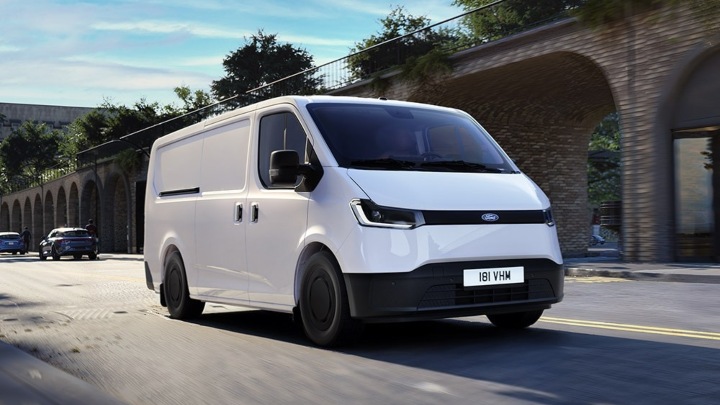 Ford Transit City panel van driving through a city street environment
