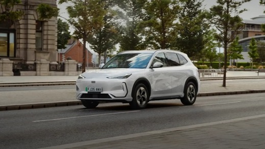 White Geely EX5 Driving in Urban Area