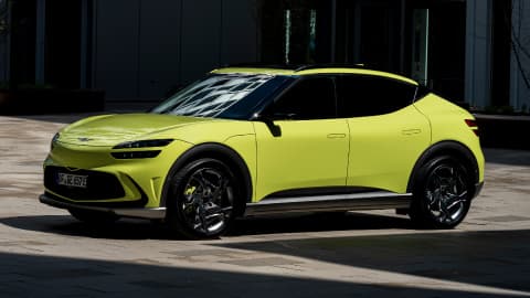 Yellow Genesis GV60 parked in a car park