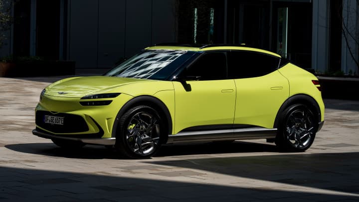 Yellow Genesis GV60 parked in a car park