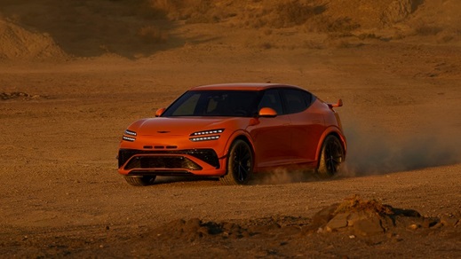 Genesis GV60 Magma driving sand