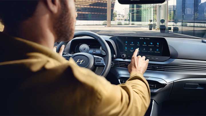 Hyundai i20 infotainment system being used by driver