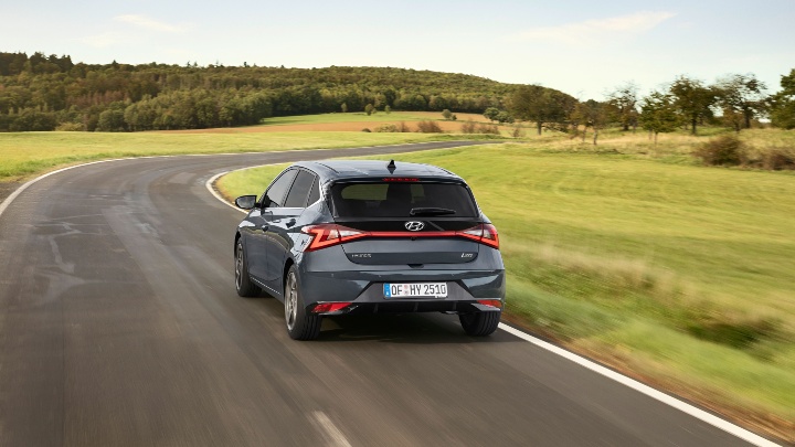 Grey Hyundai i20 driving rear 