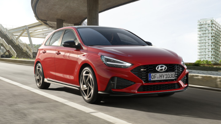 Hyundai i30 in red front angle driving