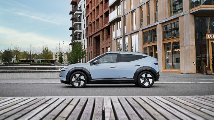 Light blue Hyundai IONIQ 3 side profile parked in urban setting