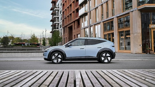 Light blue Hyundai IONIQ 3 side profile parked in urban setting