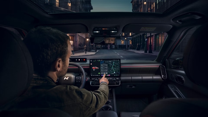 Hyundai IONIQ 3 interior with panoramic roof and central touchscreen display