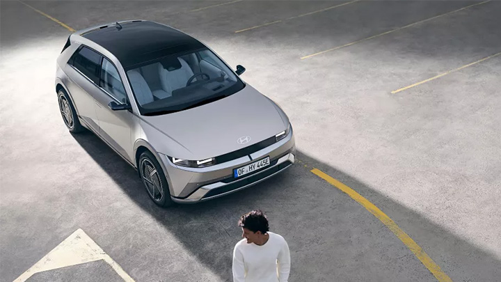 Man Standing Infront Of Silver Hyundai IONIQ 5