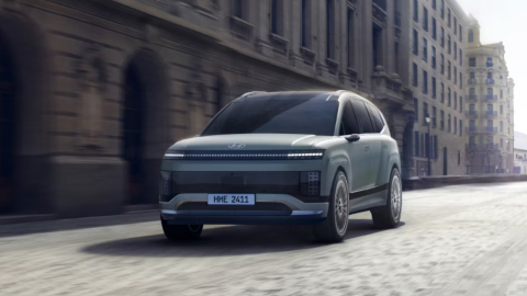 Grey Hyundai IONIQ 9 Exterior Front Driving in City