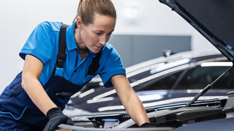 Technician Working on Car