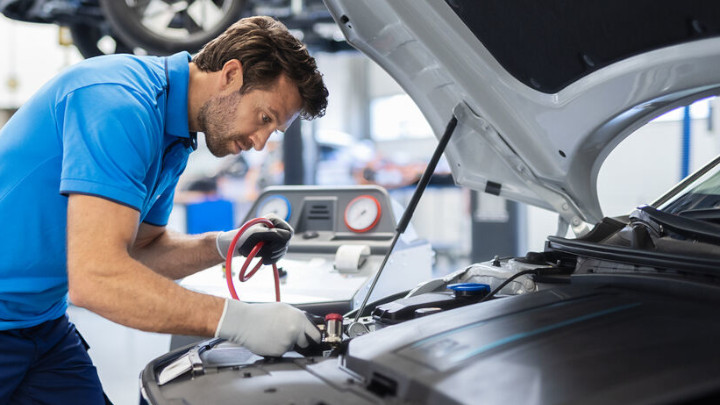 Technician Working on Car
