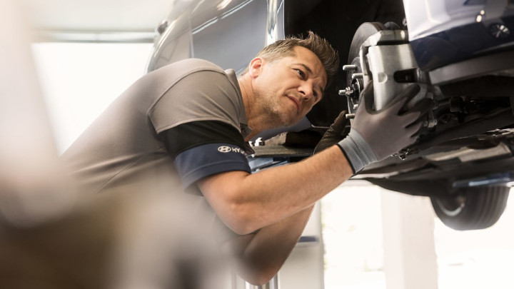 Hyundai Technician Working on Car
