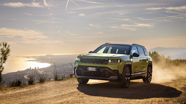 Jeep Compass Driving Off-Road with Coastal View
