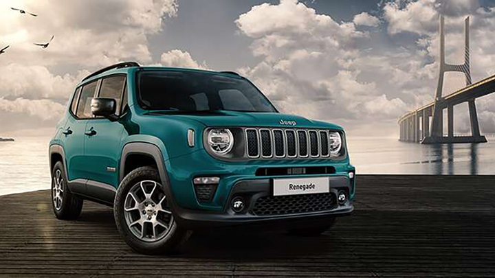 Front quarter shot of a blue Jeep Renegade with a computer generated bridge for a background