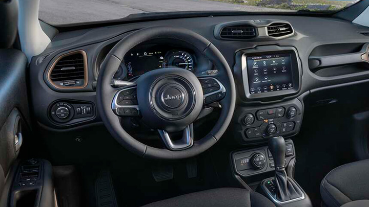 Close up of a Jeep Renegade's steering wheel and infotainment system