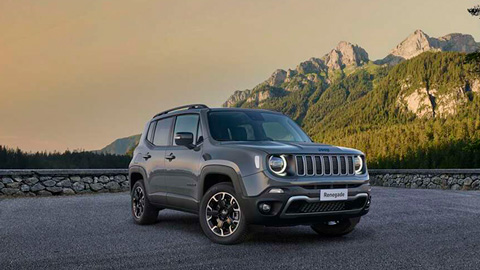 Front quarter shot of a grey Jeep Renegade with a mountain background