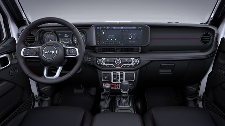 Close up of a Jeep Wrangler's steering wheel and infotainment system