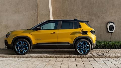 Sideways shot of a Jeep Avenger being charged via a wallbox