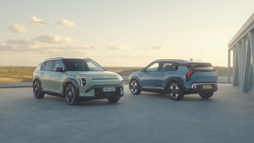 Kia EV3 Duo Outside Contemporary Home with Landscape Background
