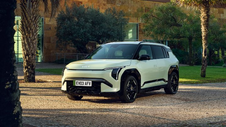 Green Kia EV3 Exterior Front Static Next to Palm Trees