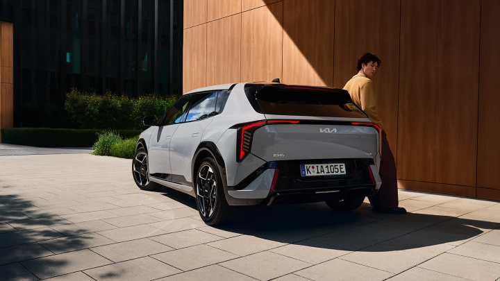 Grey Kia EV4 Exterior Rear Static with Man