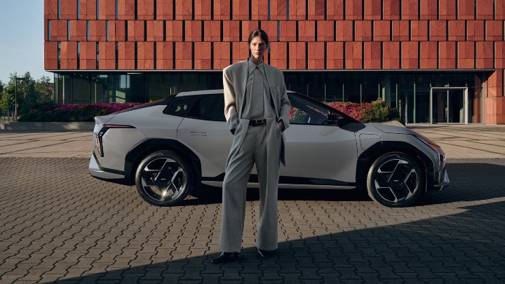 Grey Kia EV4 Exterior Side Static with Woman