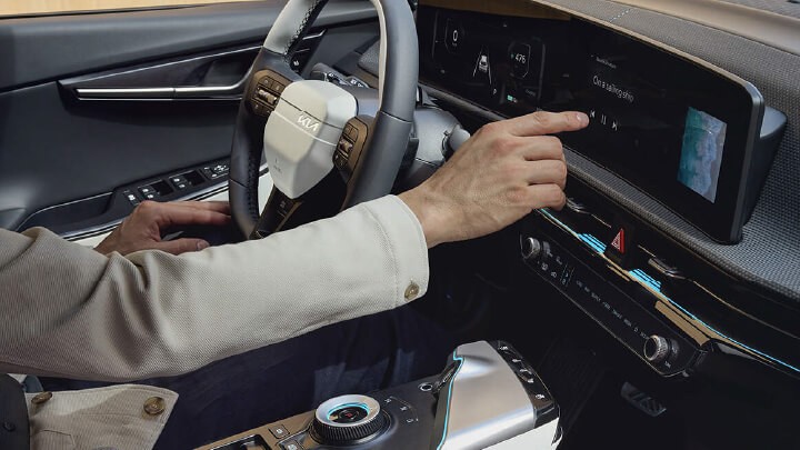 Man using Kia EV6's infotainment system