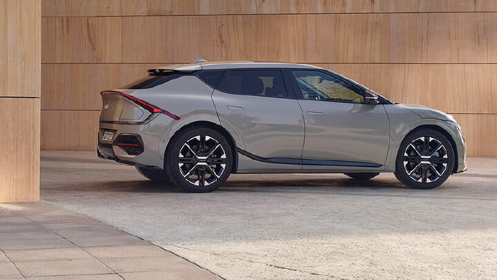 Silver Kia EV6 parked in front of a beige wall