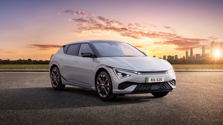 Silver Kia EV6 Exterior Front Static Exterior Front with Cityscape Background