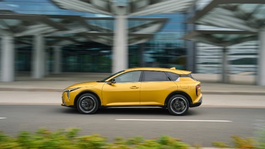 Yellow Kia K4 Exterior Side Driving